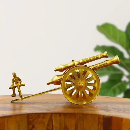 Brass canon with man showpiece statue